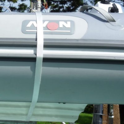 The webbing harness is used to pull the dinghy in tight and prevent movement during energetic sailing.  It maybe deployed in 3 different modes to suit the yacht/dinghy combination.    This shows the stern strap when attached using the davit arm end eye.
