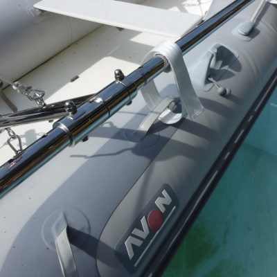 The dinghy can be attached to the frame by velcro straps when docking and to further aid stability during lift, launch and carriage.