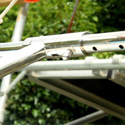 The davit arms carrying the dinghy hinge against an adjustable locking boss so the fitter can achieve horizontal arms on a transom of any normal rake (0 to say 30 degrees).