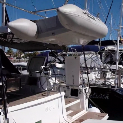 Showing the dinghy fully elevated, which is the same at anchor by a beach, or moored in a port